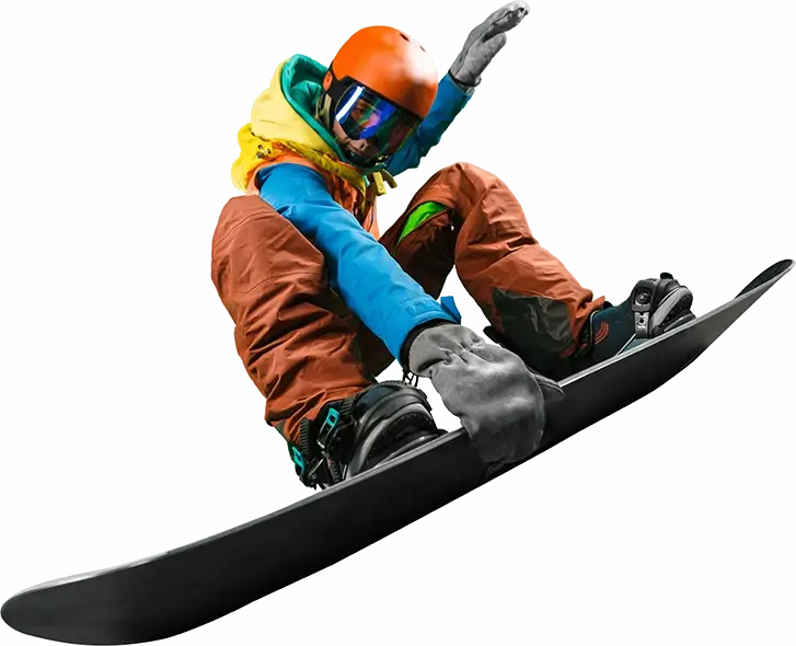 Excited snowboarder in brightly coloured snow clothes performing an aerial trick by grabbing his snowboard.