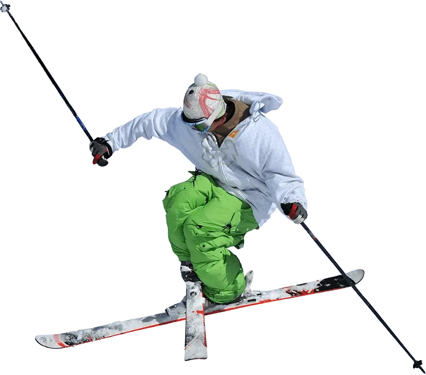 Male skier crossing his skis while performing an aerial trick.