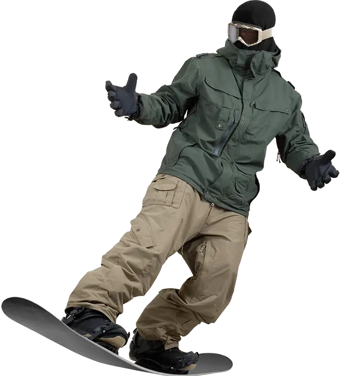 Snowboarder casually snowboarding down a slope with his hands and arms out.